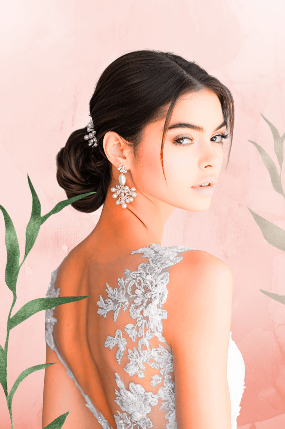Woman wearing a lace wedding dress with a pink background and green leaves.